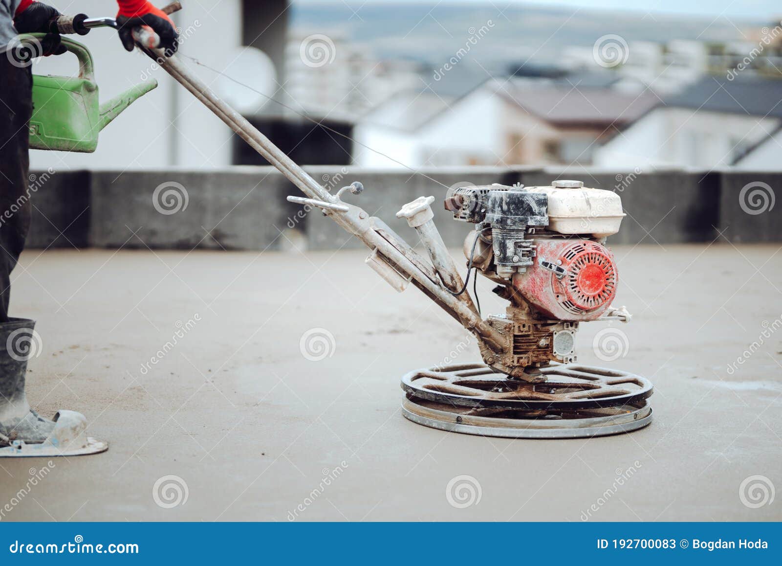 Construction Worker Using Power Tool and Polishing Sand and Cement