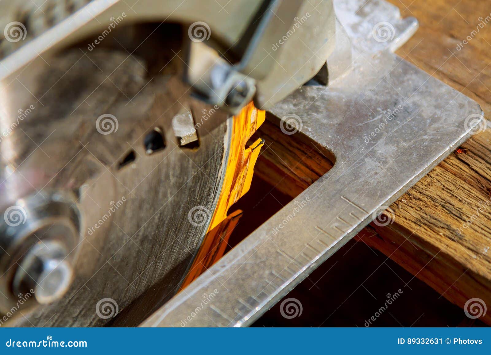 Construction Worker Using Saw or Circular Saw for Cutting Wood Stock