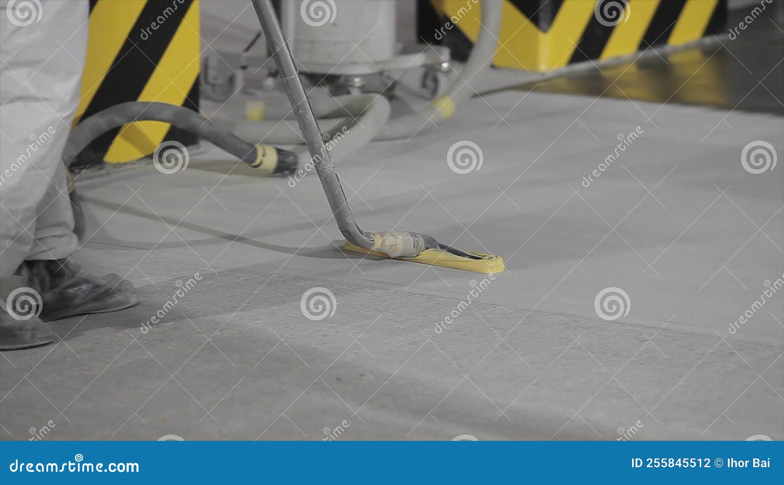 Working with an Industrial Vacuum Cleaner. the Construction Worker