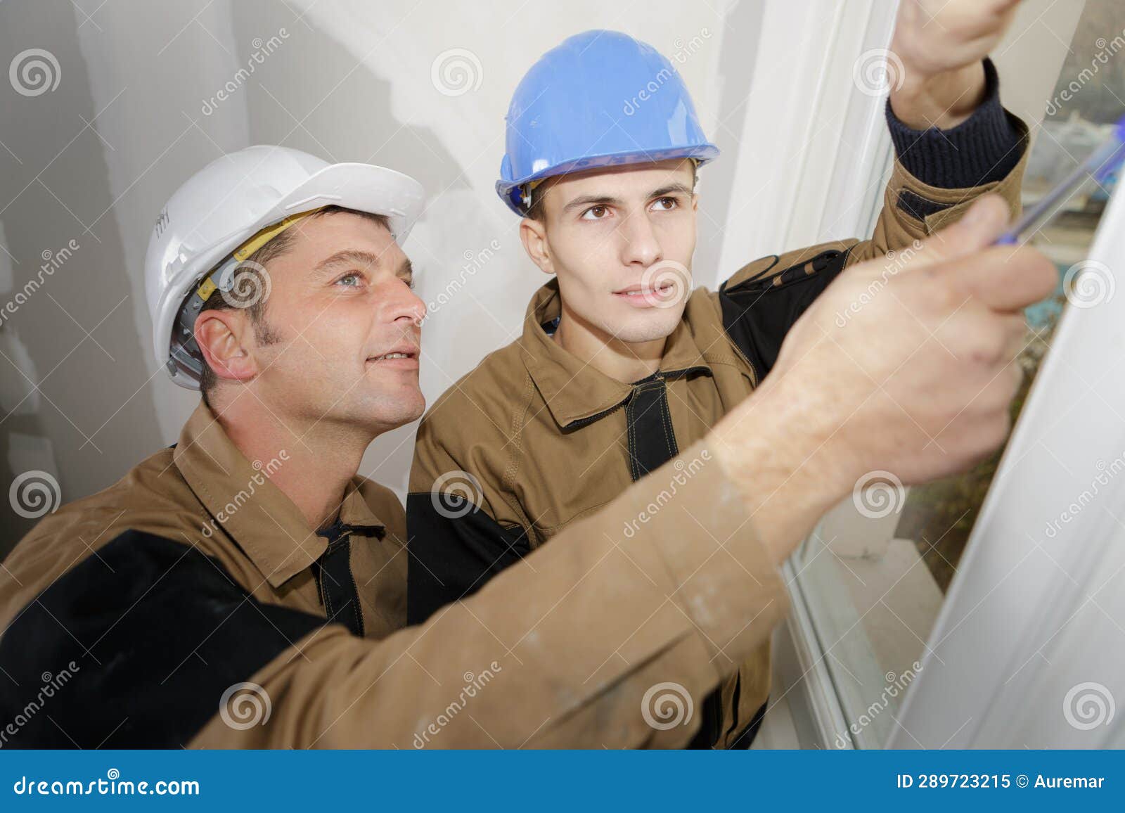 construction workers cleaning joints
