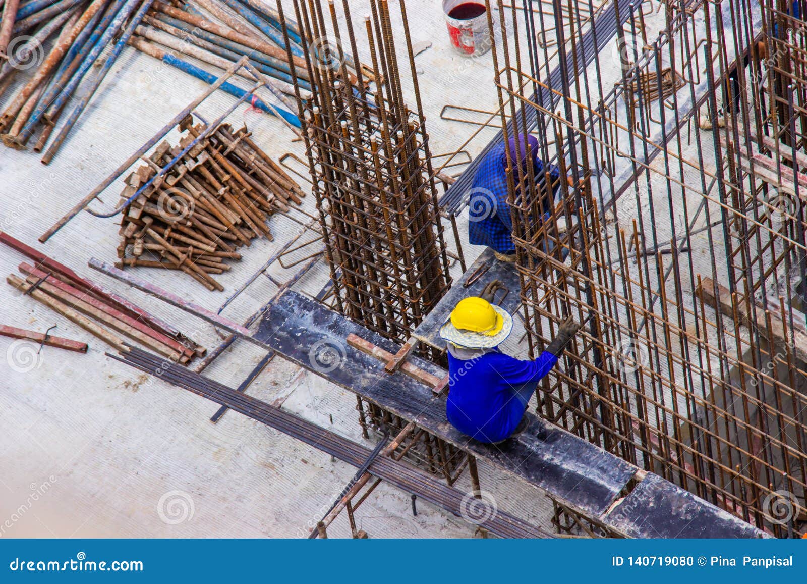 Construction Workers Fabricating Large Steel Bar Reinforcement Bar at