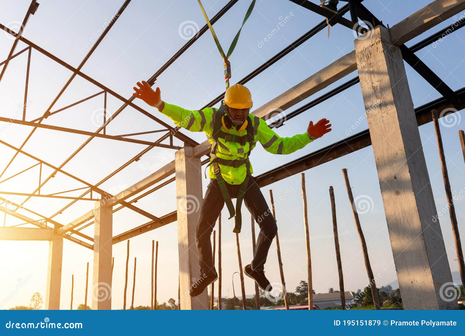 construction workers fall from a height but have safety to help. concept of preventing danger from heights with safety on the