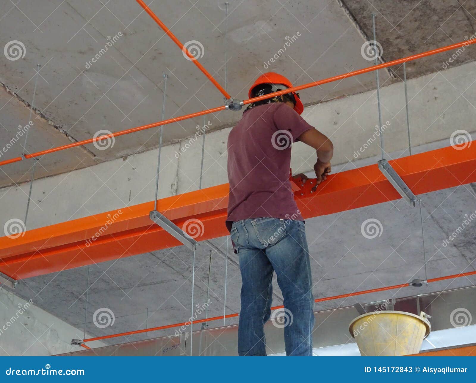 Construction Workers Installing Electrical Cable Tray and Doing Wiring