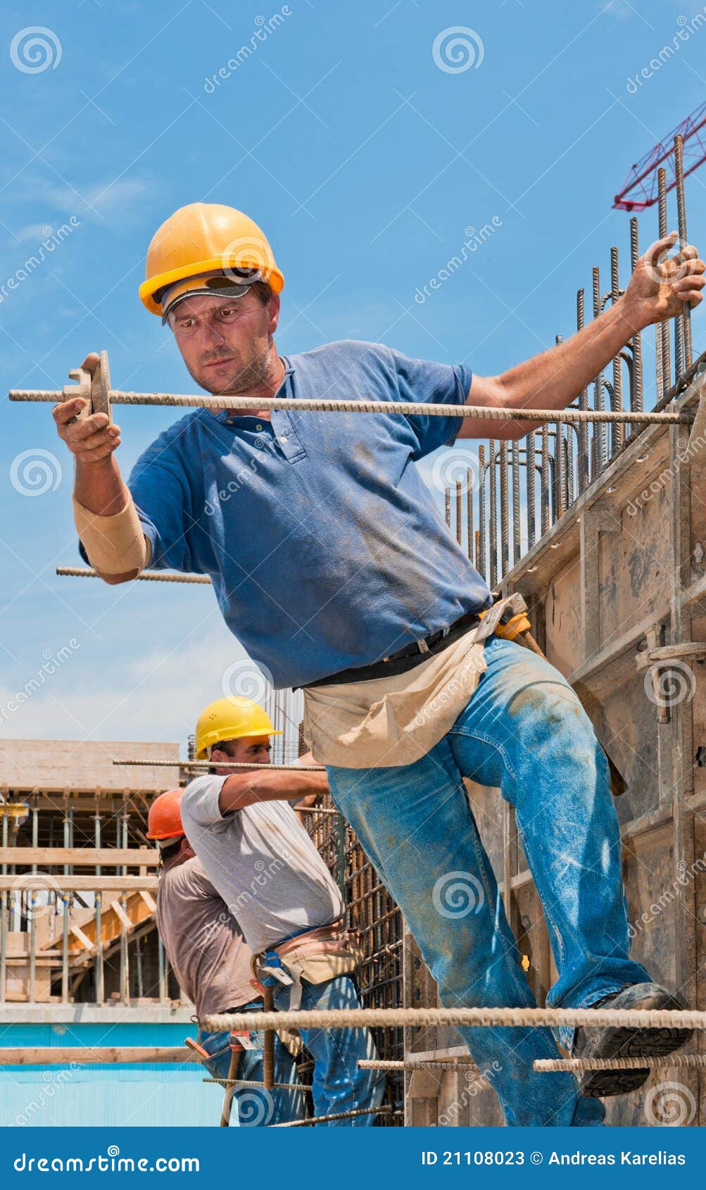 construction workers installing formwork frames