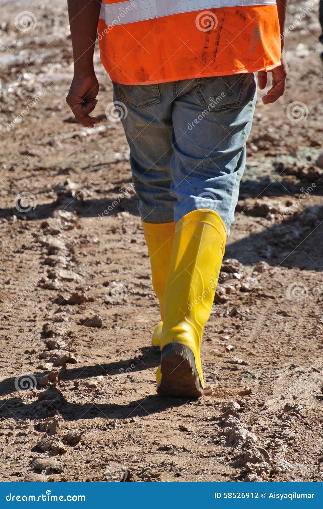 A Construction Workers Walking in the Construction Site Stock Photo