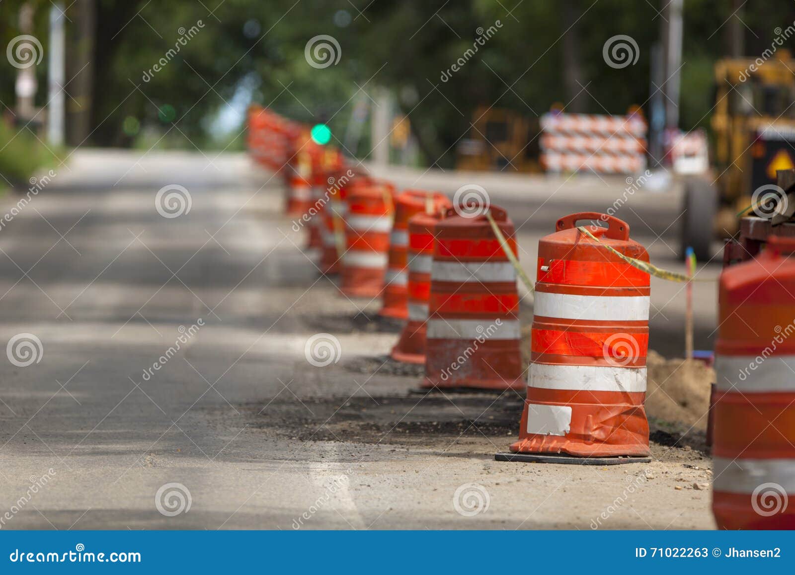 Construction Zone Orange Caution Markers Along Urban Street Stock