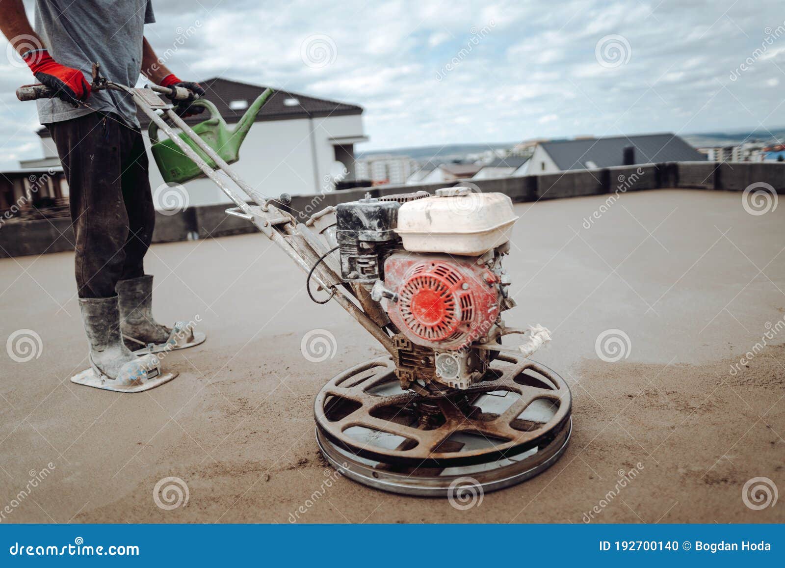 Constrution Worker Performing and Polishing Sand and Cement Screed