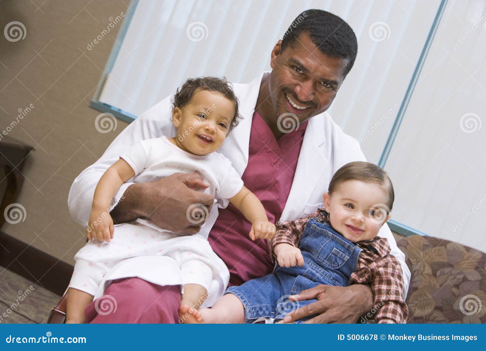 consultant holding two ivf children