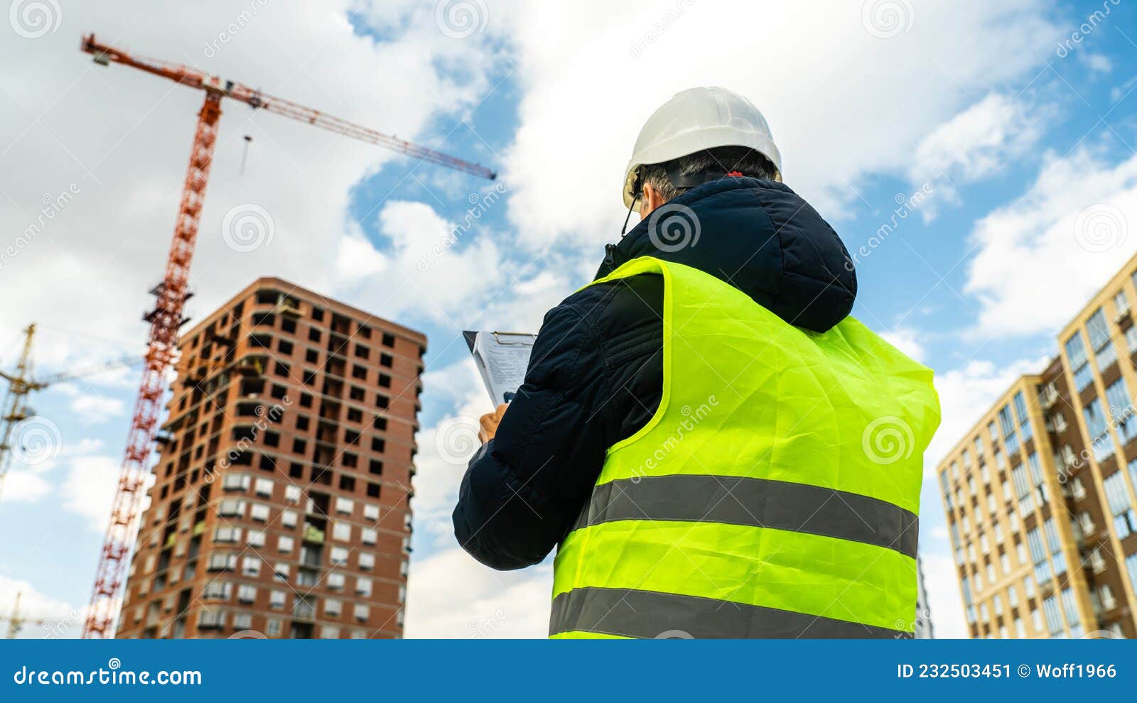 Consulting Engineer at Construction Site Holding Blueprint in Hand ...