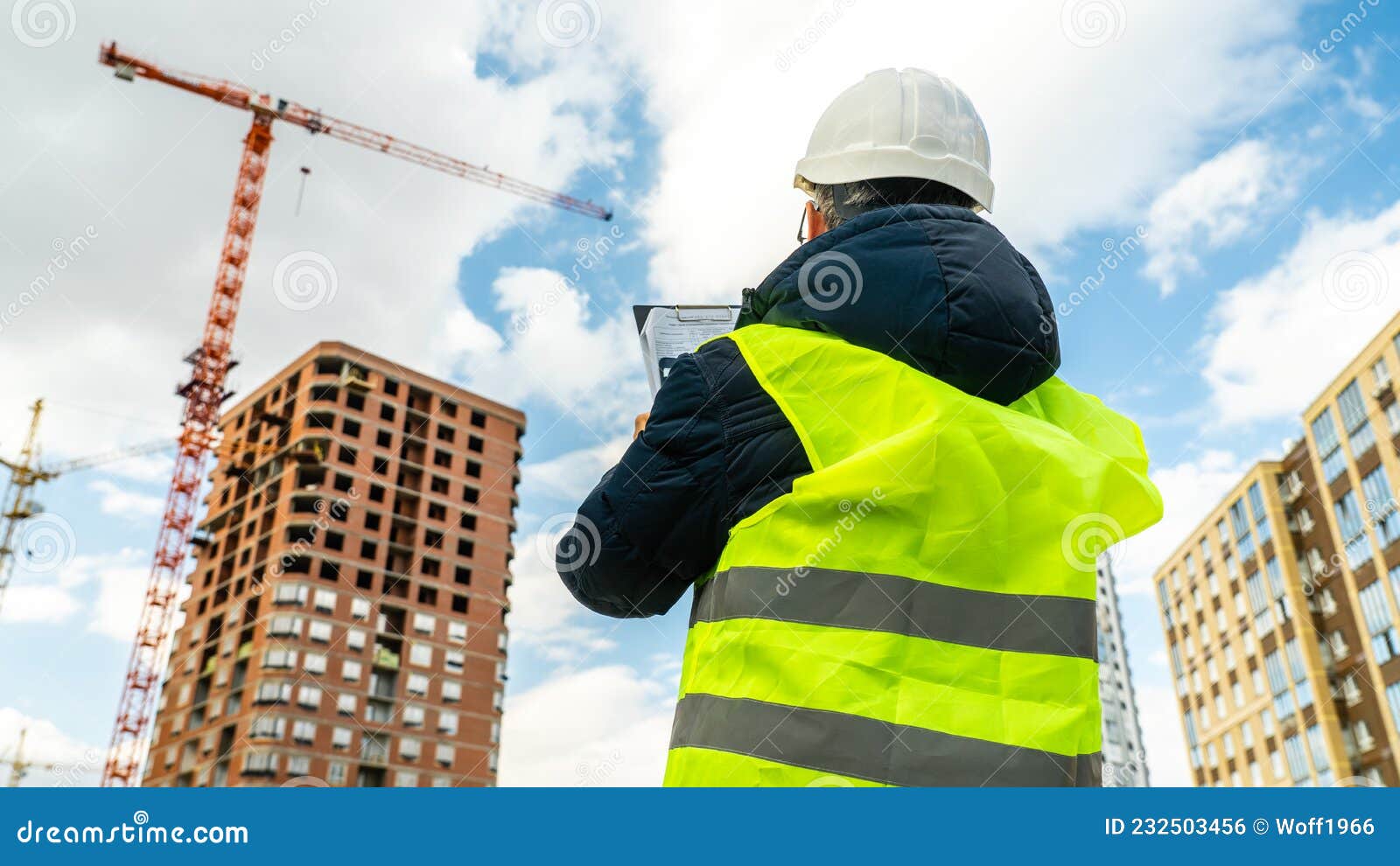 Consulting Engineer at Construction Site Holding Blueprint in Hand ...