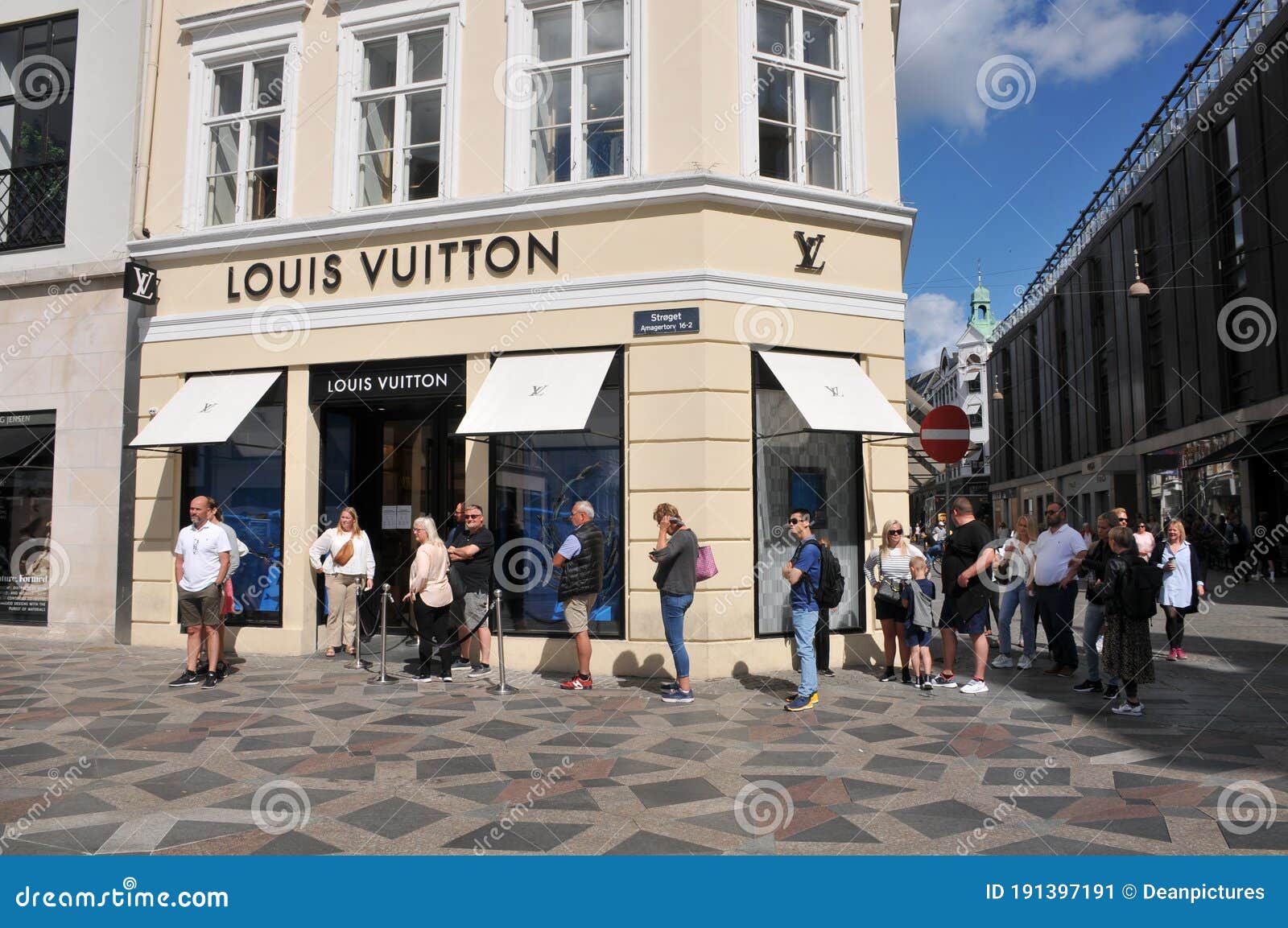 Consumers Standing in Line Outside Louis Vuittons Store Editorial