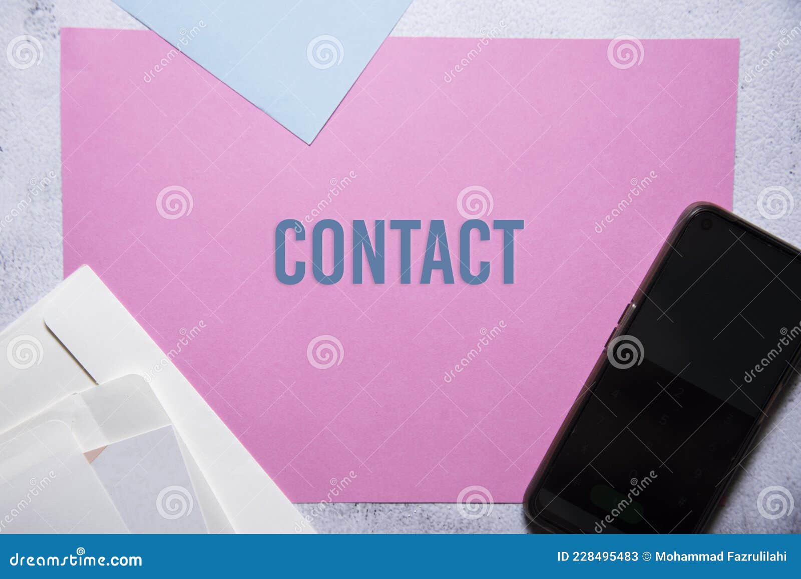 contact text on pink and blue background flat lay concept
