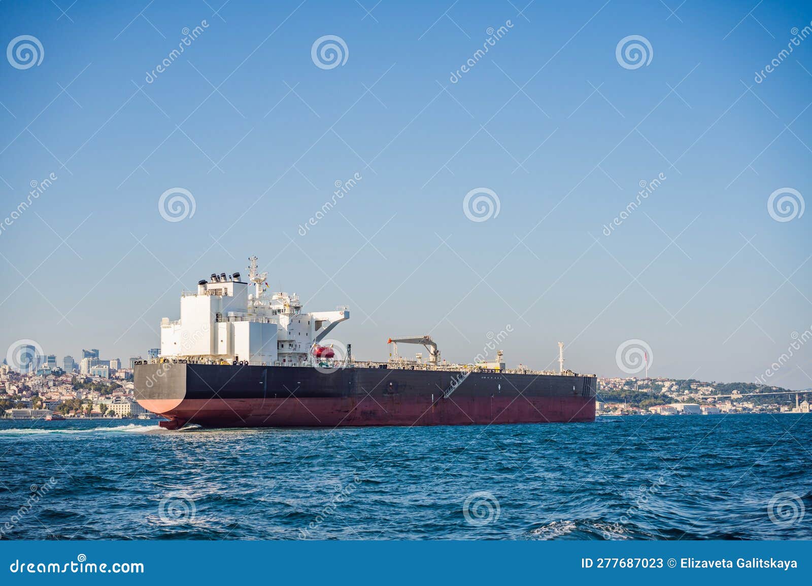 Container Cargo Ship in the Bosphorus, Istanbul, Turkey Stock Image