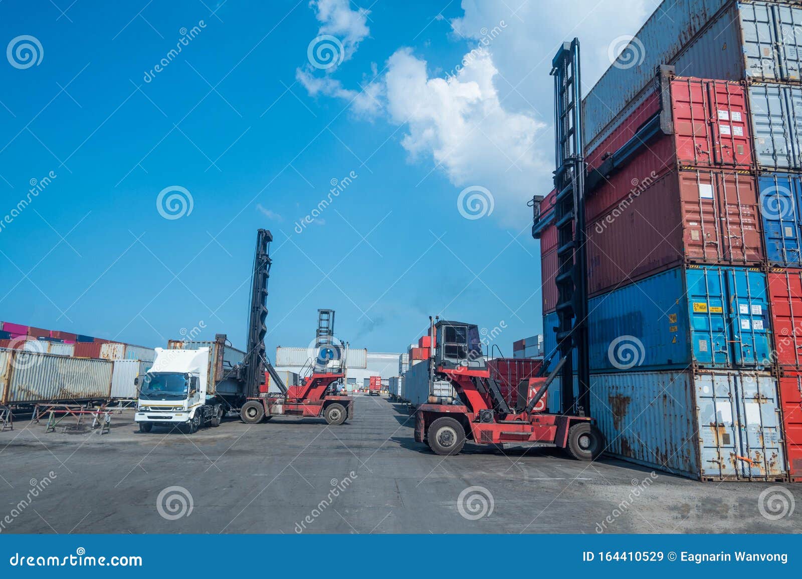 Container Handlers In The Shipping Dock With Storage Cabinet