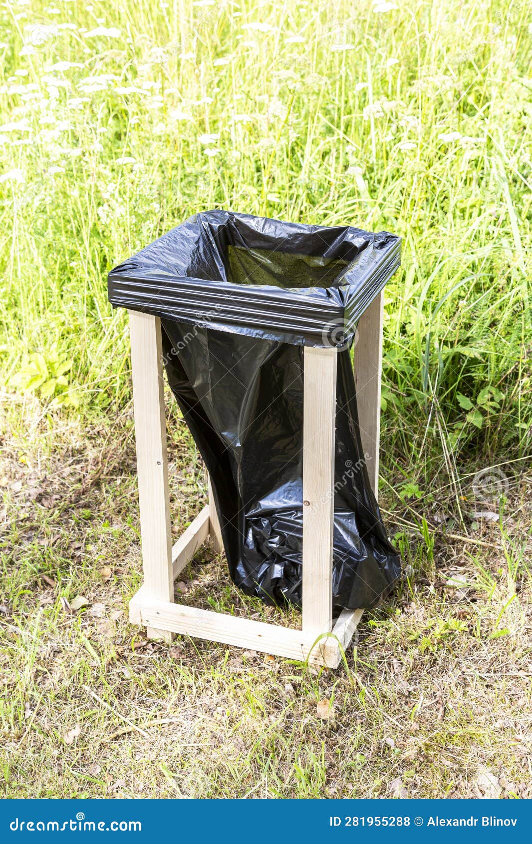 Container for Waste and Trash Made of Wooden Slats and a Plastic Bag