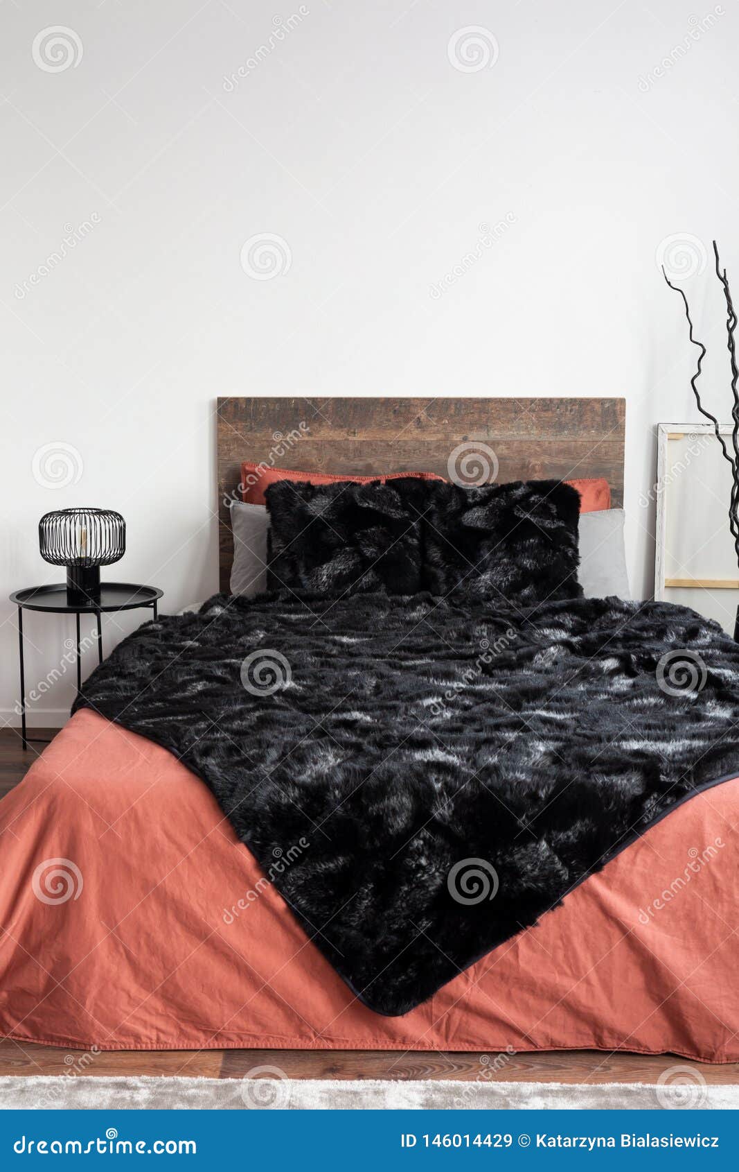 Bedroom with Black Blanket and Coral Bedsheets Stock Image Image of