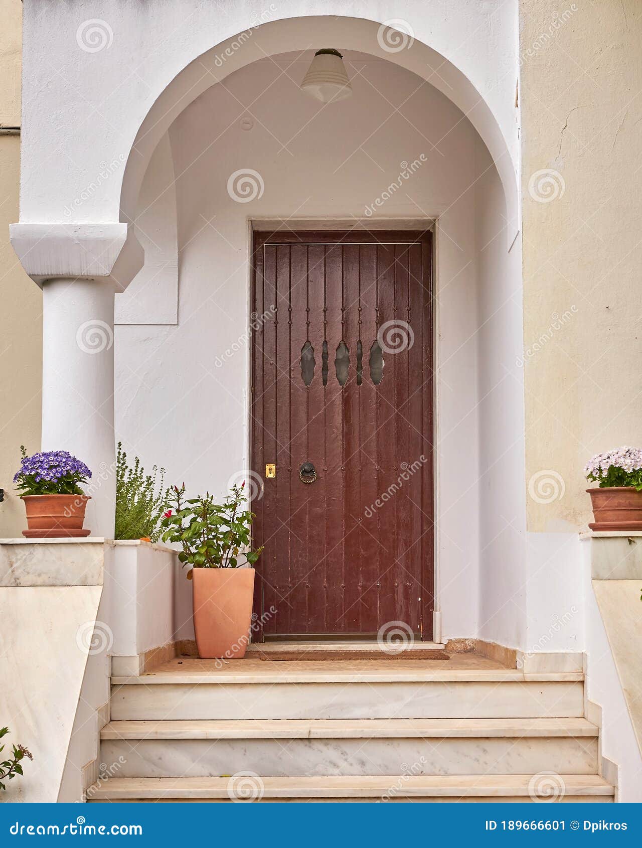 Arched Doorways And Terracotta Tiles: Architectural Hallmarks Of Mediterranean Homes