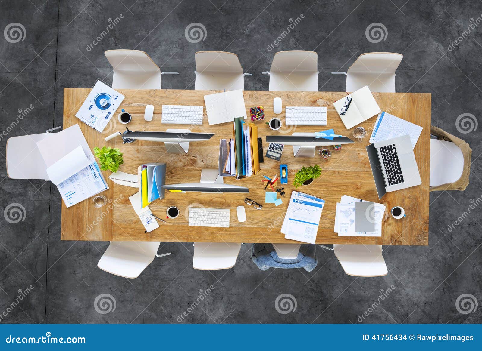 contemporary office table with equipments and chairs