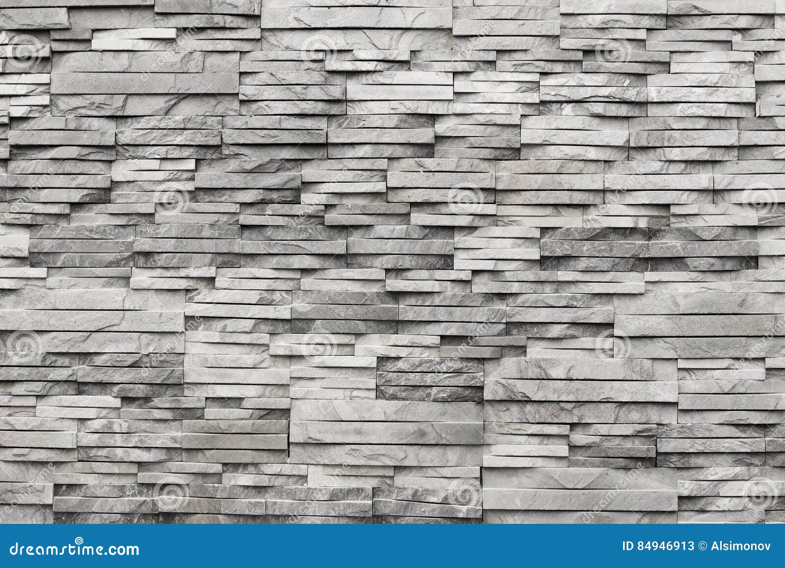 Contemporary Wall of Light Grey, Natural Stone. Texture Stock Image