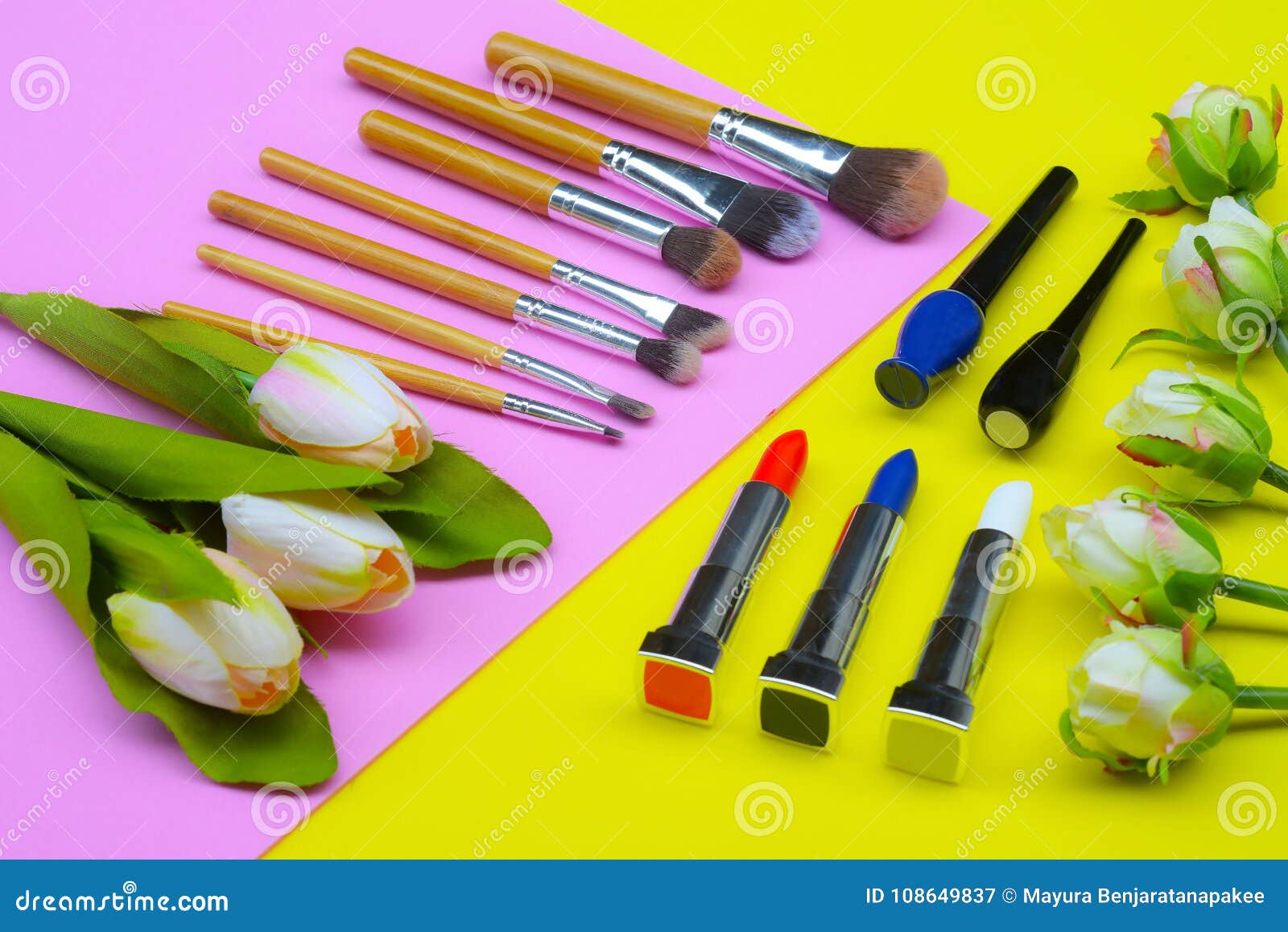 Content of Cosmetic Bag. Lipstick, Eye Shadows, Brushes for Makeup on