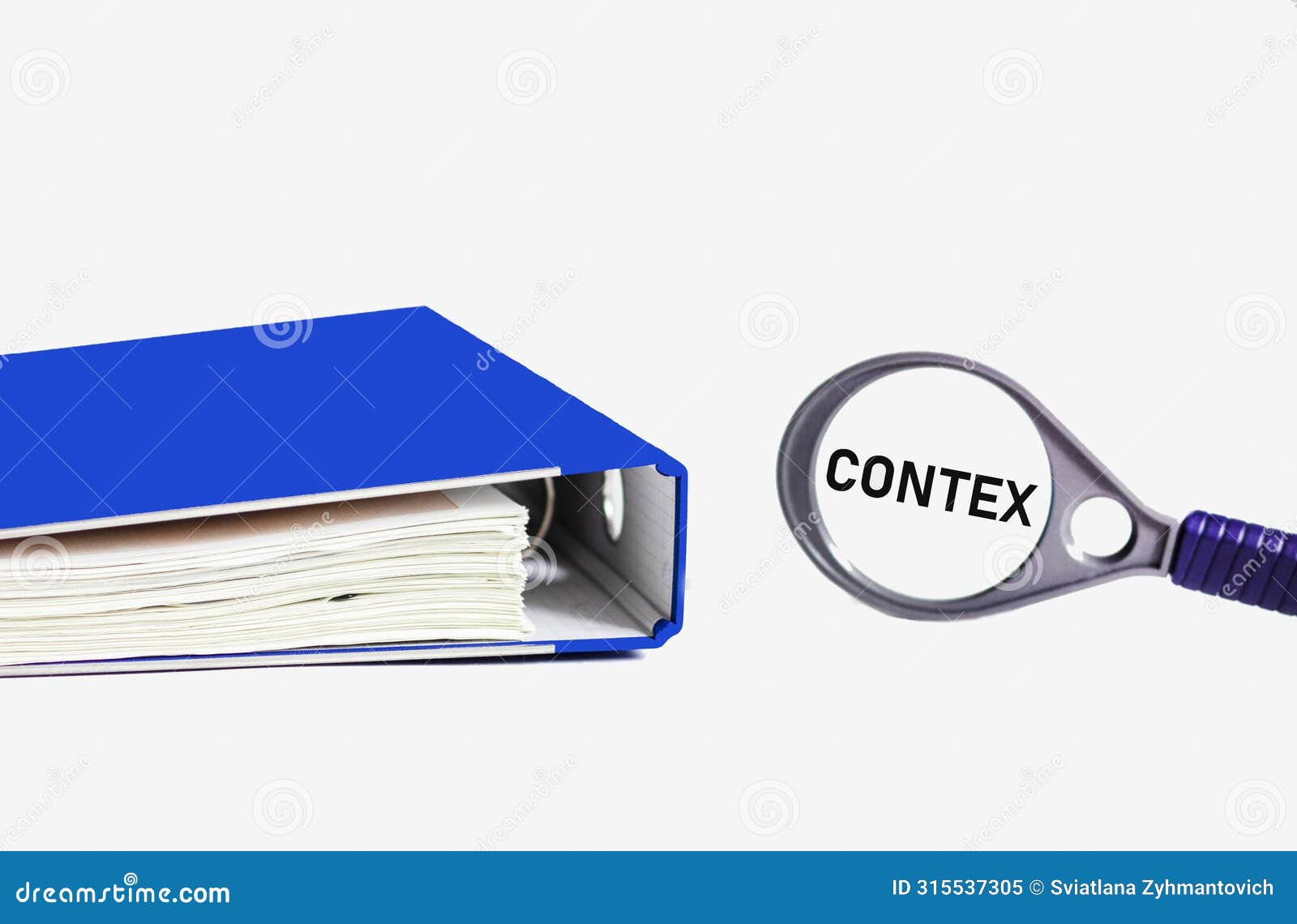 context, business concept image. on a magnifying glass the word contex on a white background with a blue folder