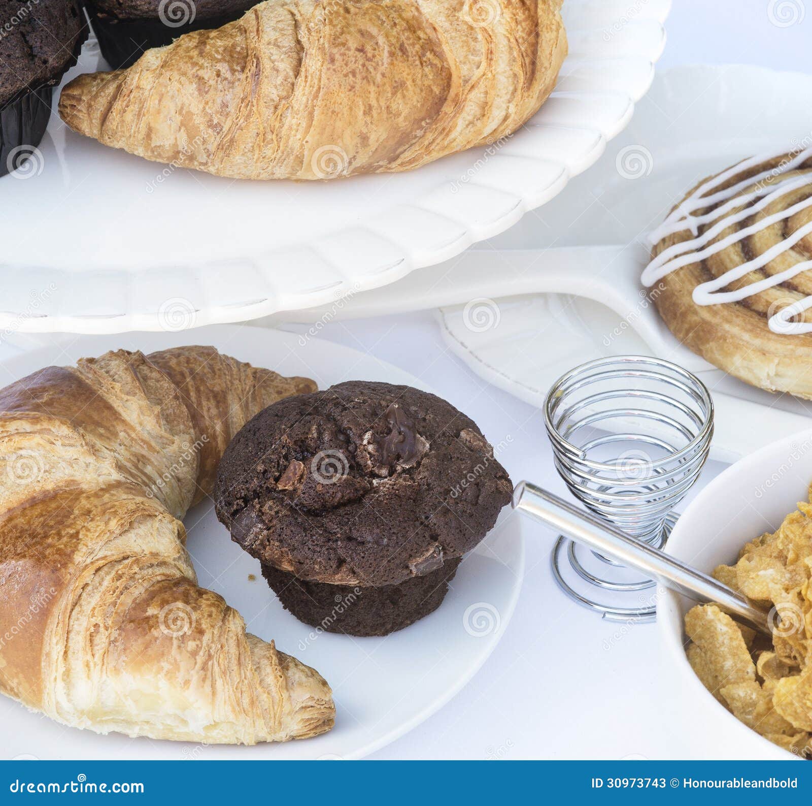Continental Breakfast Table Setting with Pastries and Cakes Stock Image