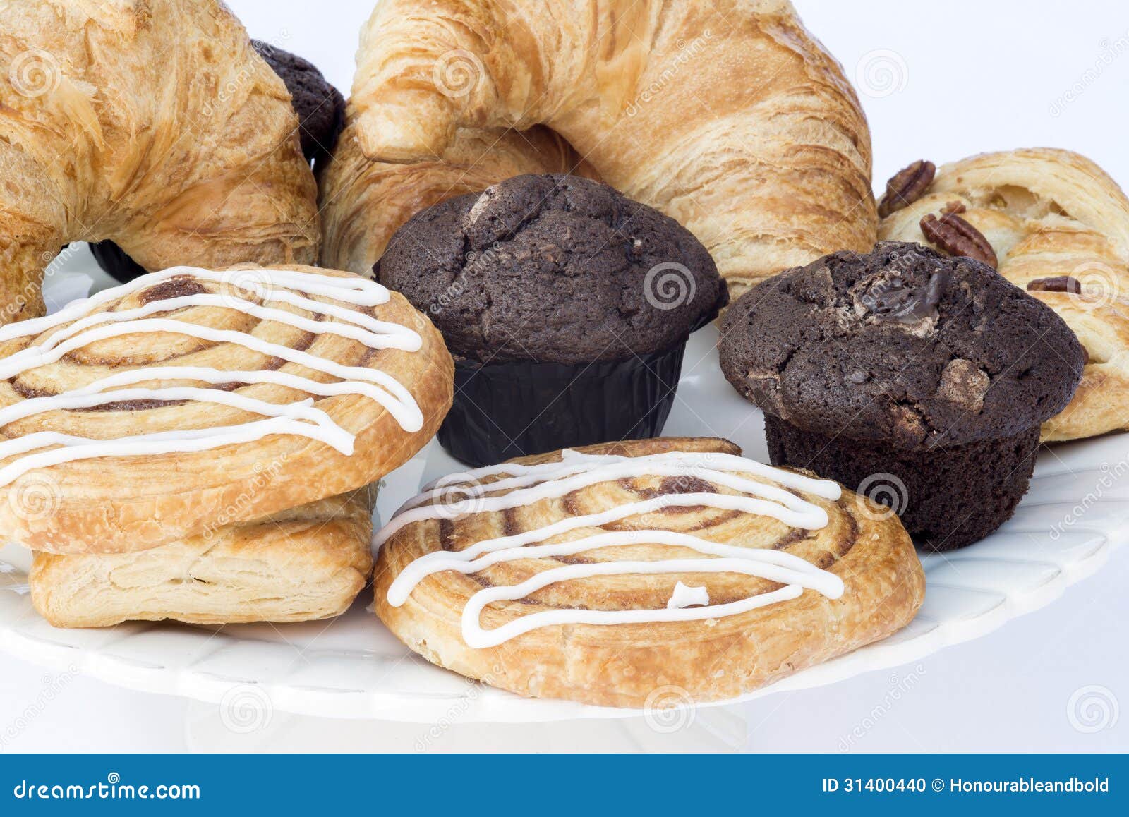 Continental Breakfast Table Setting with Pastries and Cakes Stock Photo