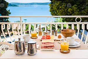 Continental Morning Breakfast Table Setting With Sea View Is Served 