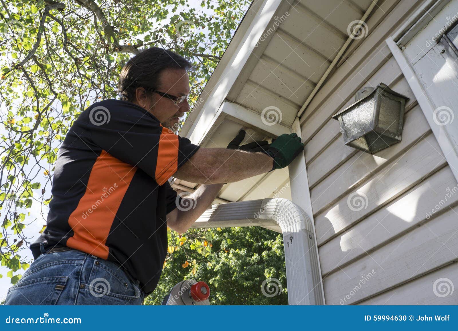 Contractor Fixing Vinyl Siding for Customer Stock Photo Image of