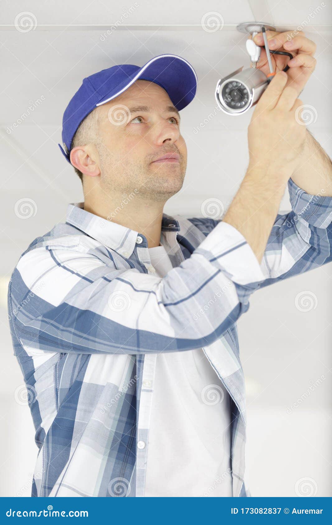 Contractor Installing Surveillance Cctv Cameras in Office Stock Image
