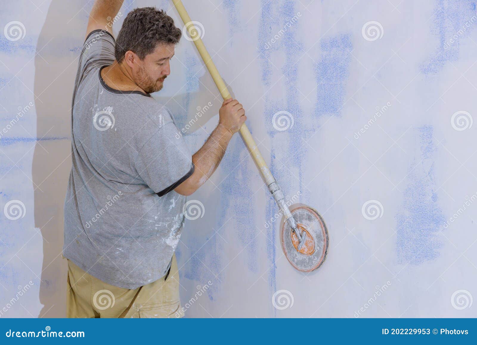Contractor Using Sand Trowel Sanding the Drywall Stock Image Image of