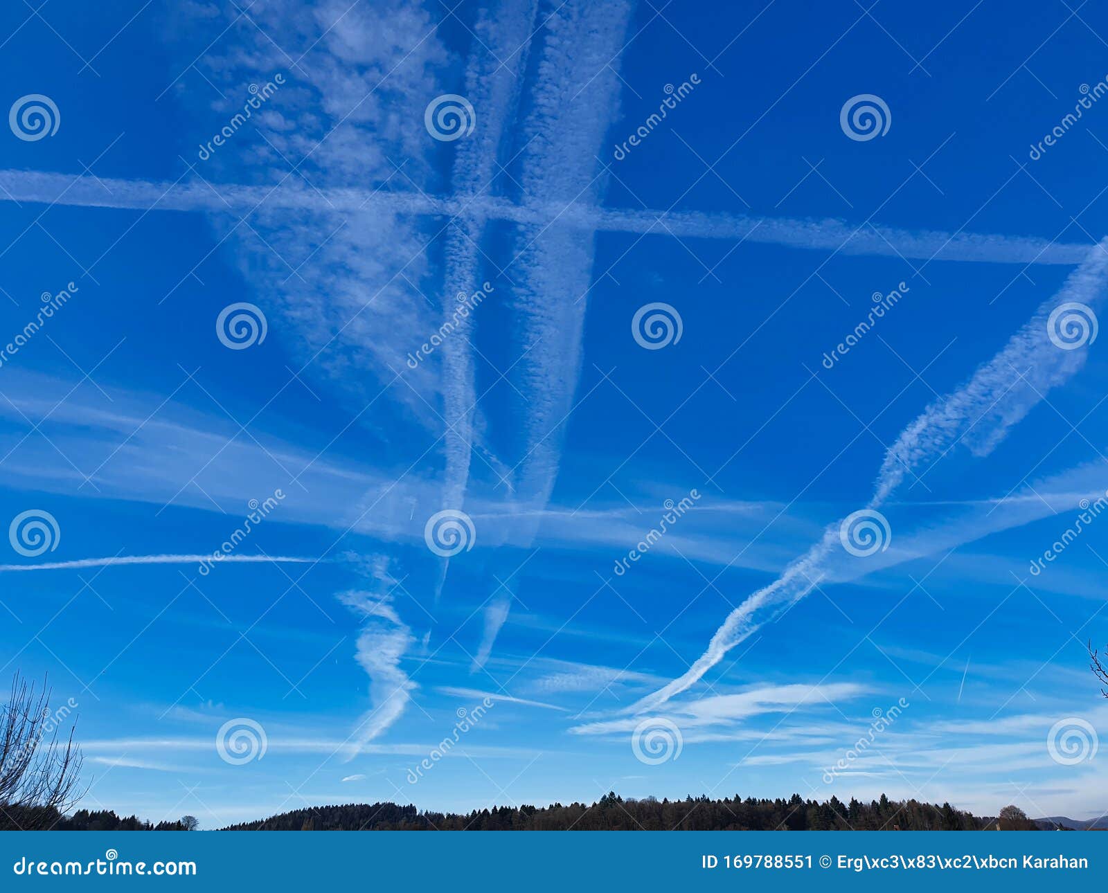 contrails, traces of air traffic in the sky.
