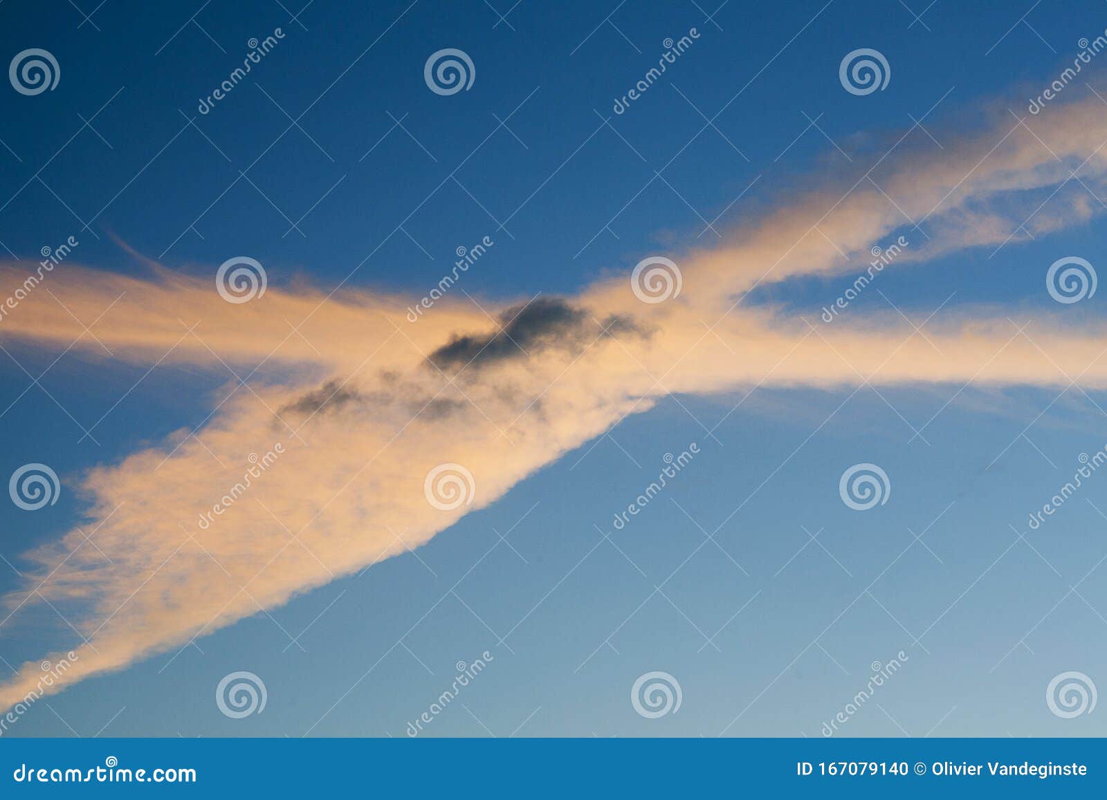 two contrails crossing in the sky.