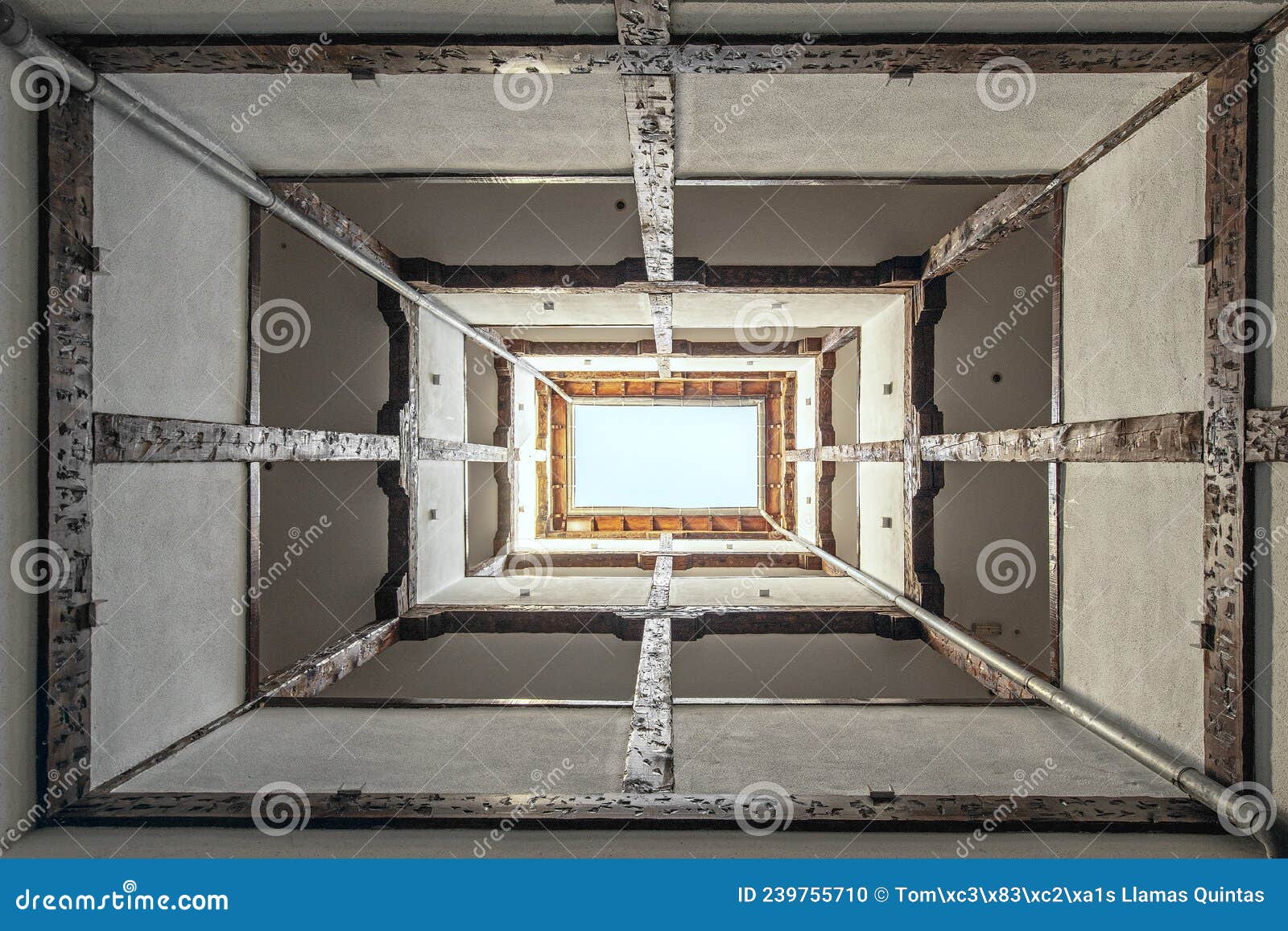 contrapicado image of stairwell of an old building with rehabilitated