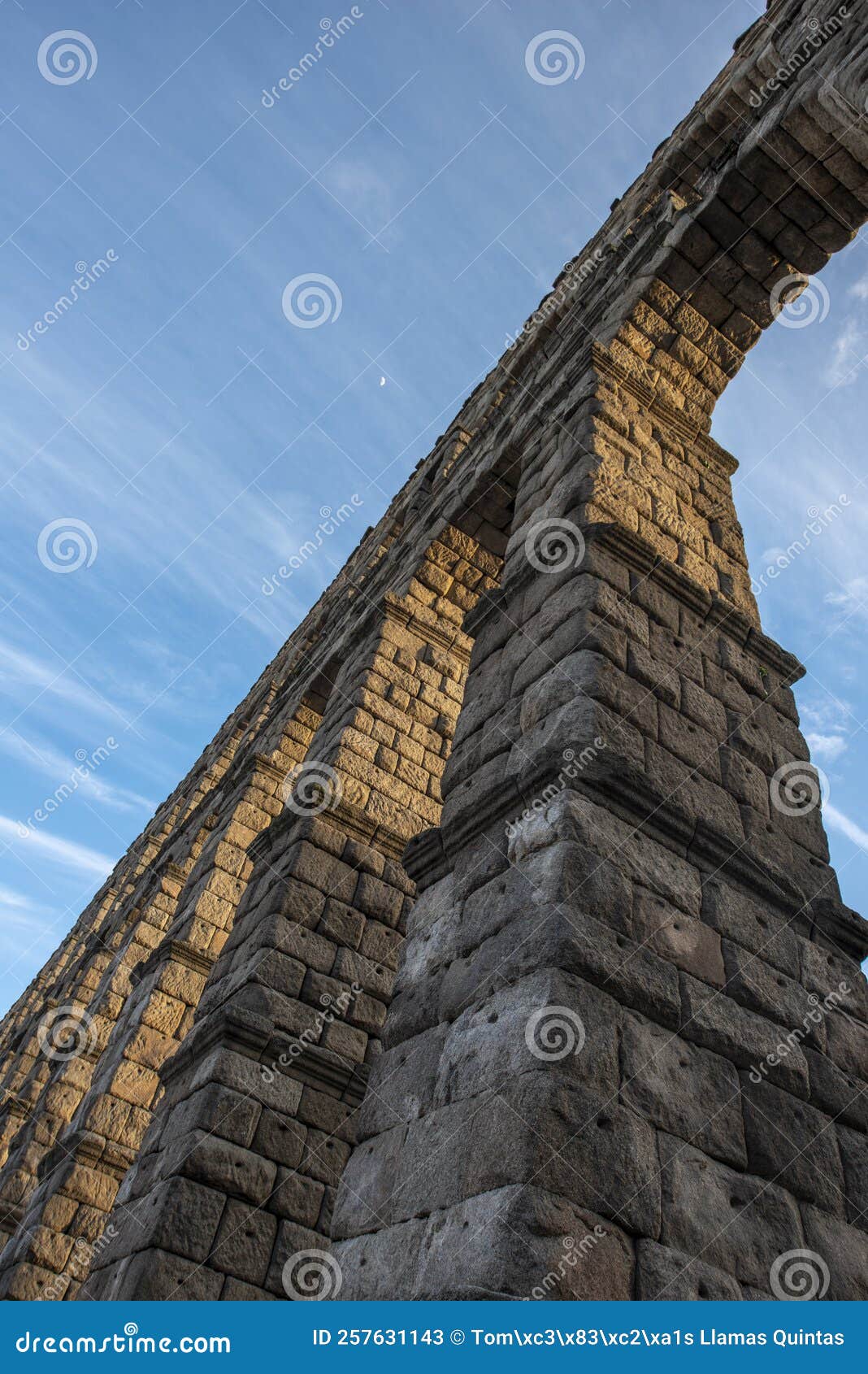 contrapicado image of stone arches of the roman aqueduct of segovia