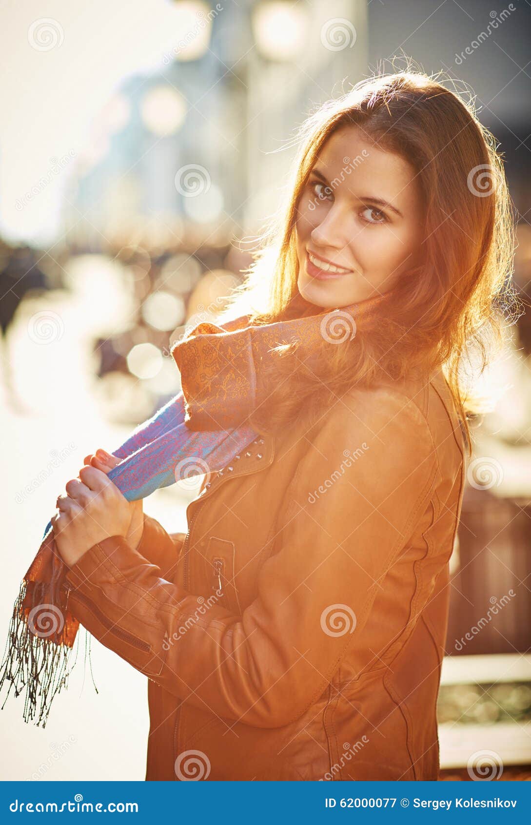 contre-jour outdoor portrait of beautiful redhead woman
