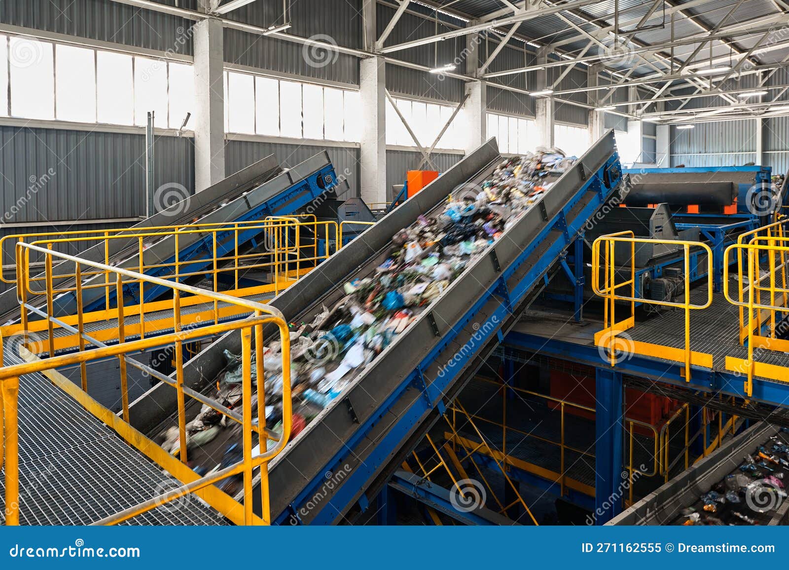 Conveyors Carry Trash and Empty Platforms at Recycling Plant Stock