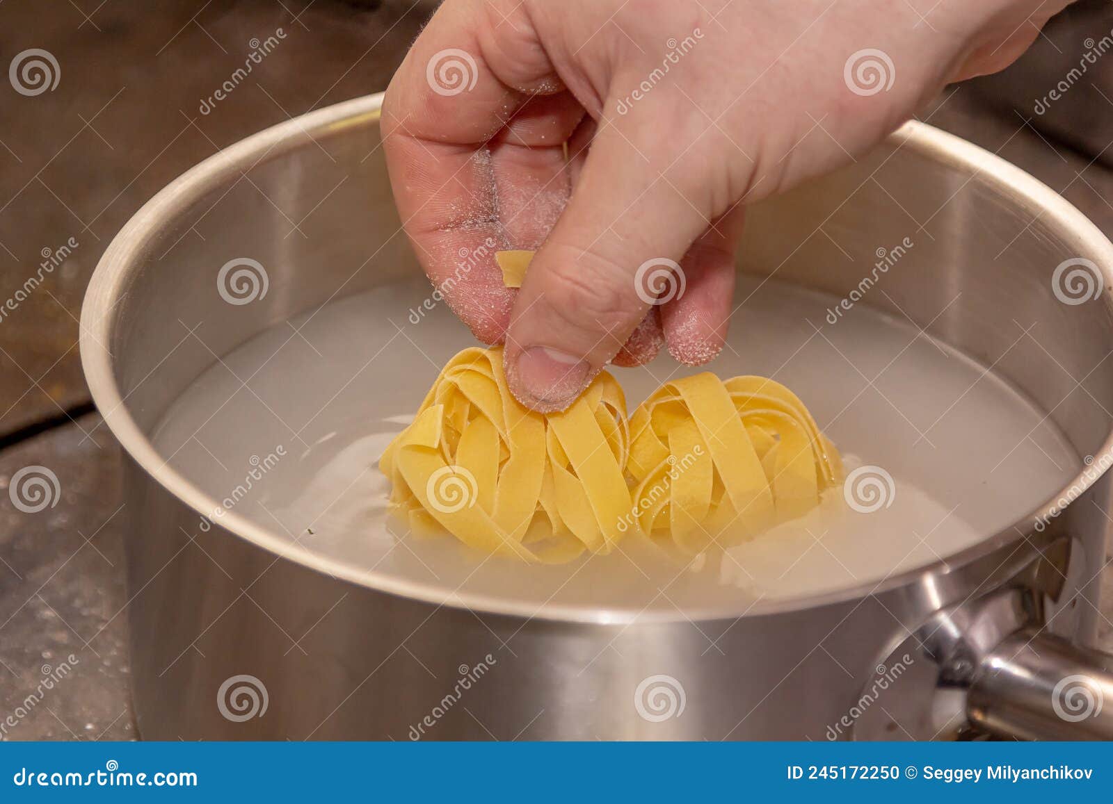 The Cook Boils Pappardelle Pasta in a Saucepan Stock Photo Image of
