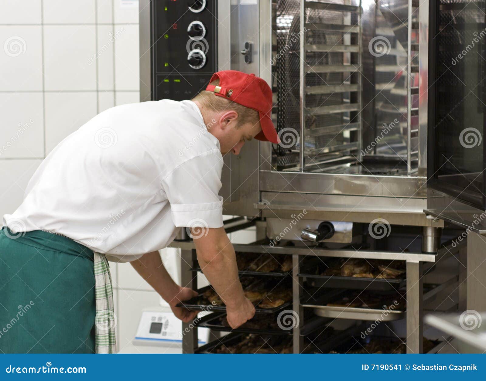 Cook at commercial stove stock image. Image of operating 7190541