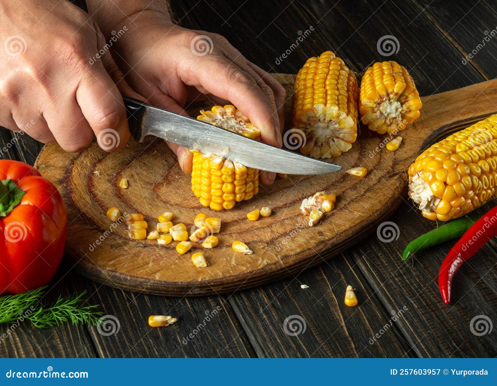 The Cook Cuts Corn with a Knife. Maize is an Excellent Dietary
