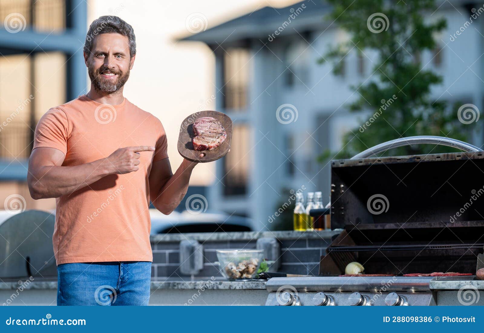 Cook Showcasing His Barbecue Techniques at Cookout Event. Man Enjoying