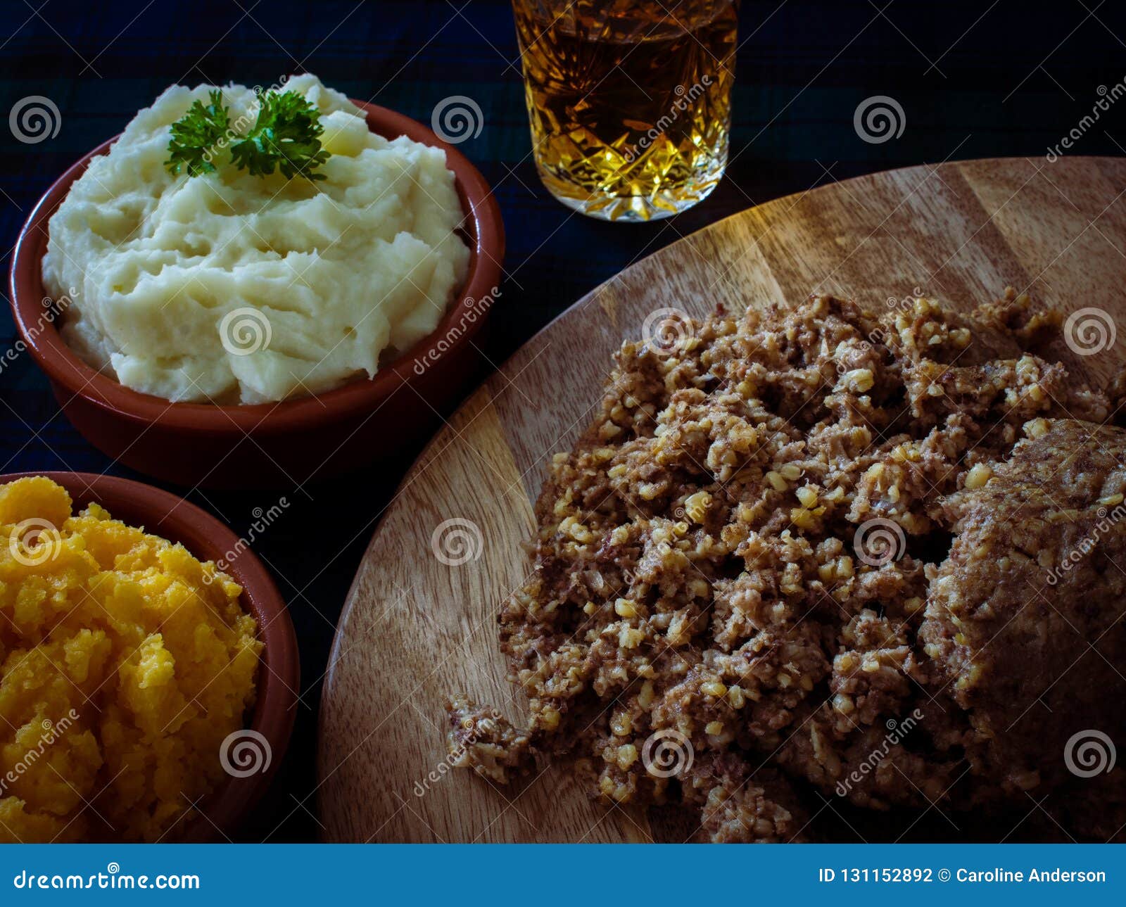 haggis, with mashed potatoes, mashed swede and a wee dram of scotch whiskey. burns night, scotland