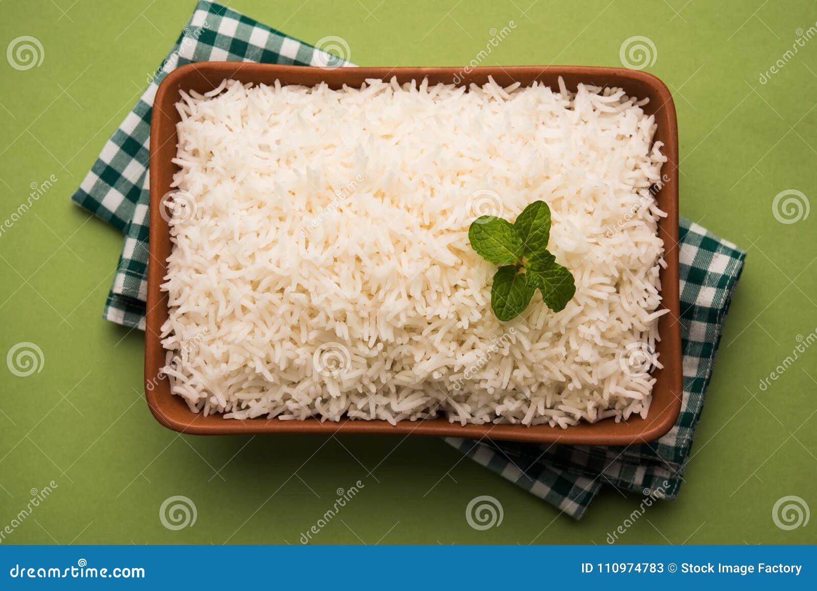 cooked plain white basmati rice in terracotta bowl, selective focus