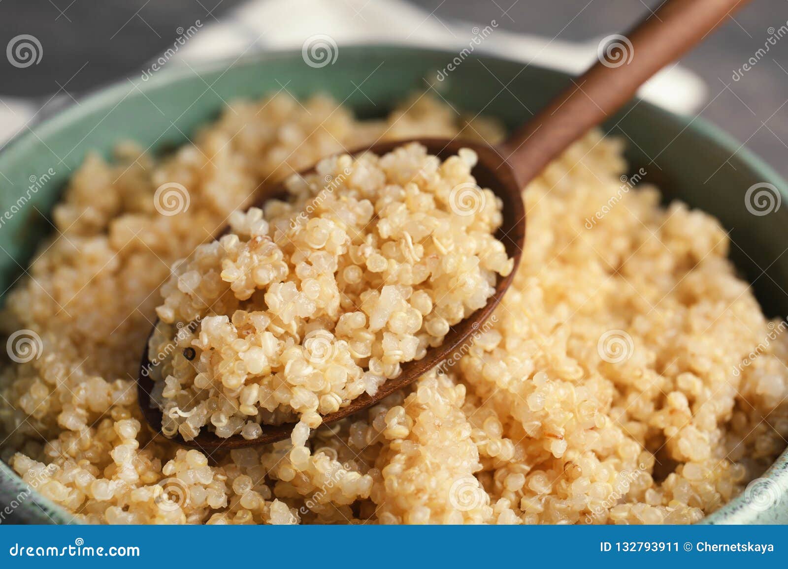Cooked Quinoa in Bowl and Wooden Spoon Stock Image - Image of object