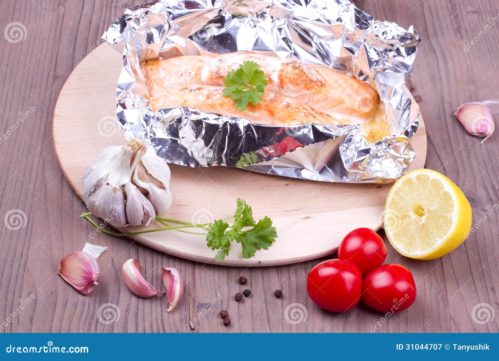 Cooked salmon in a foil stock image. Image of fish, parsley 31044707