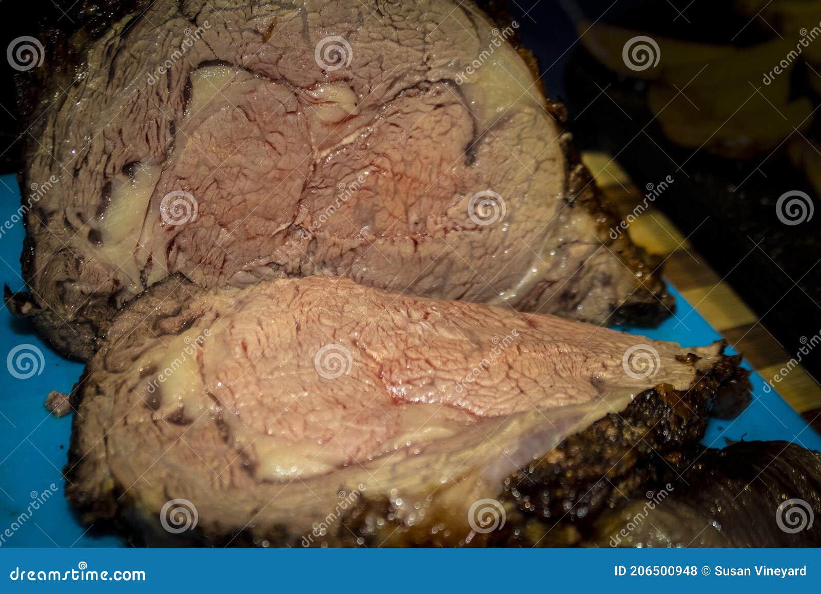 Cooked Two Bone Standing Rib Beef Roast on Cutting Board Sliced