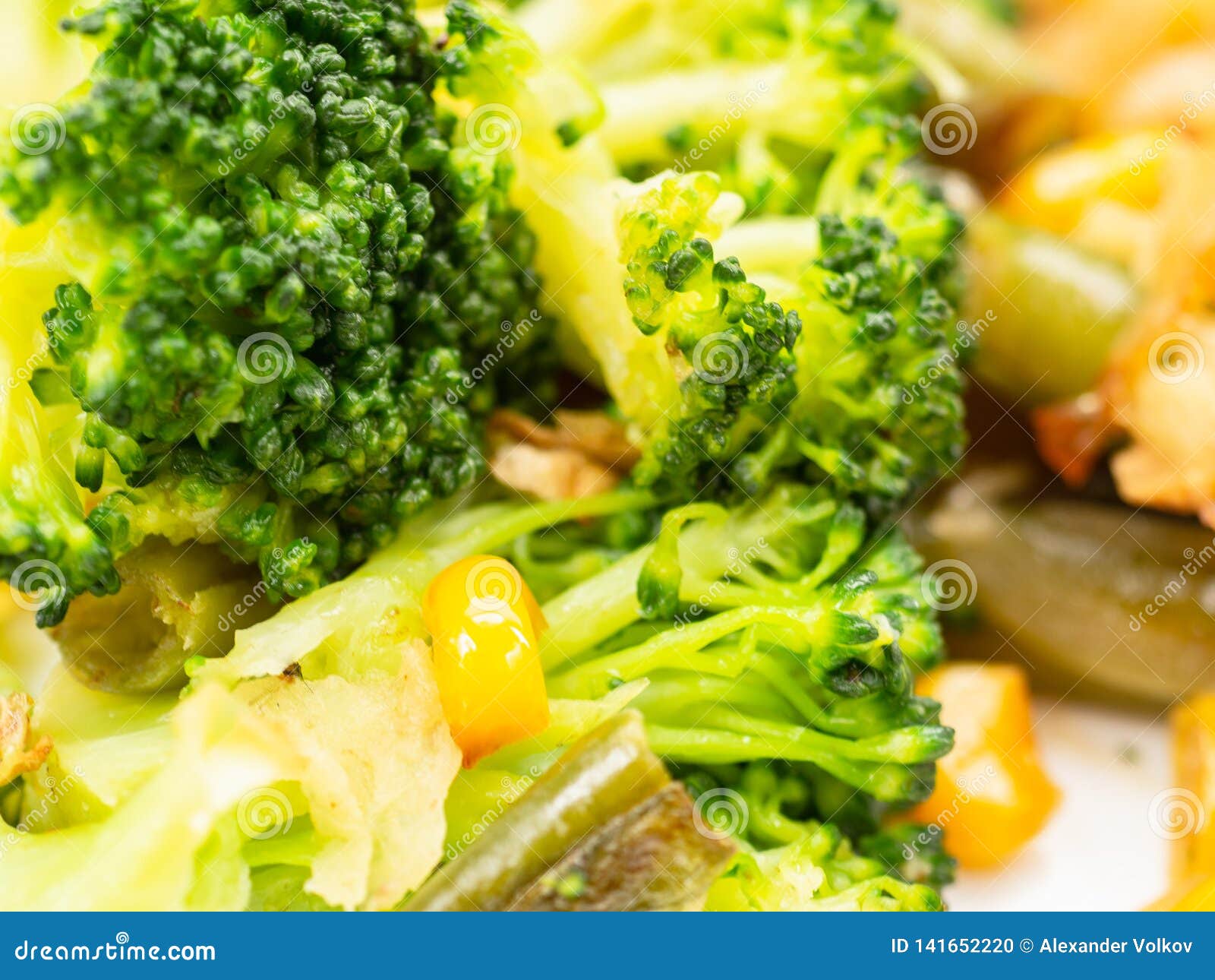 Cooked Vegetables Broccoli, Carrots, Green Beans, Corn on a White Plate