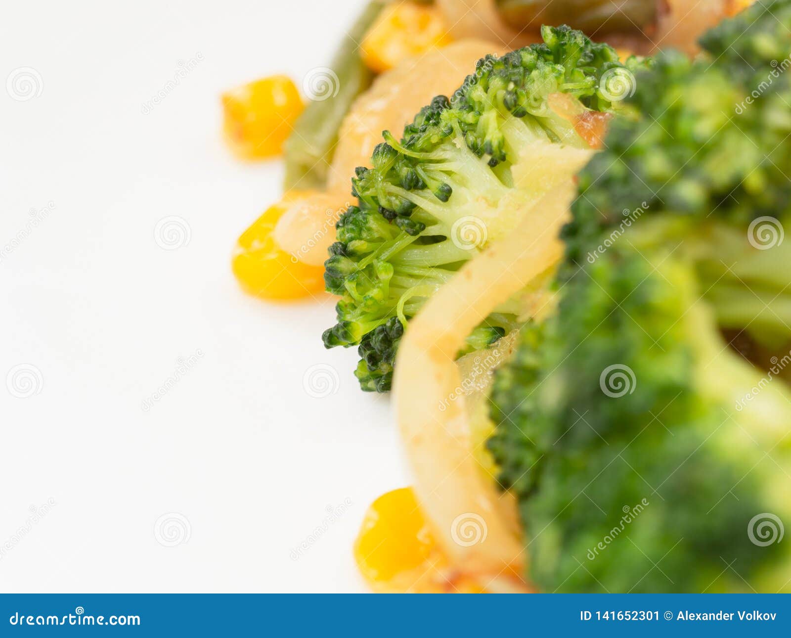 Cooked Vegetables Broccoli, Carrots, Green Beans, Corn on a White Plate