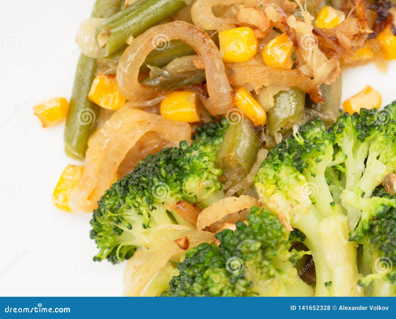Cooked Vegetables Broccoli, Carrots, Green Beans, Corn on a White Plate