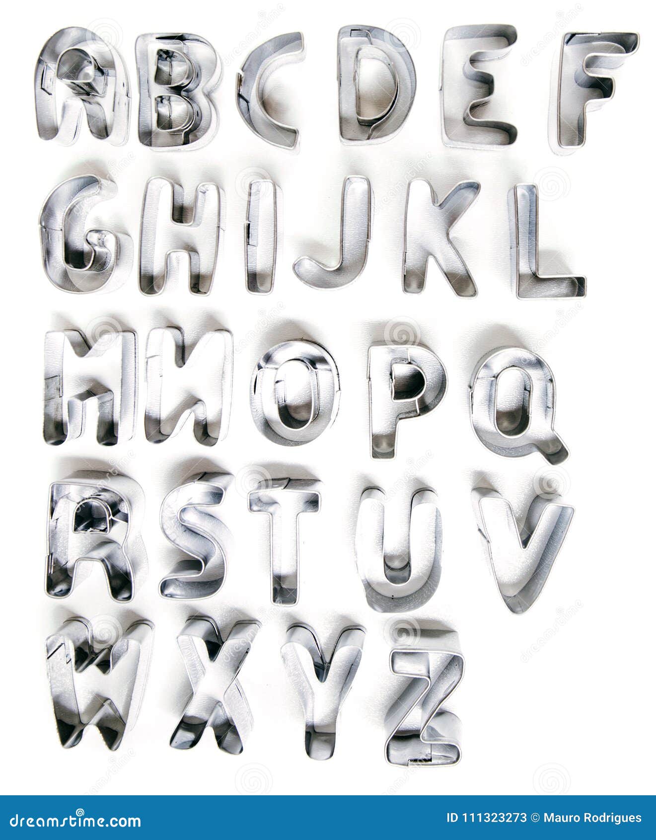 Cookie cutter letters stock image. Image of metal, learning 111323273